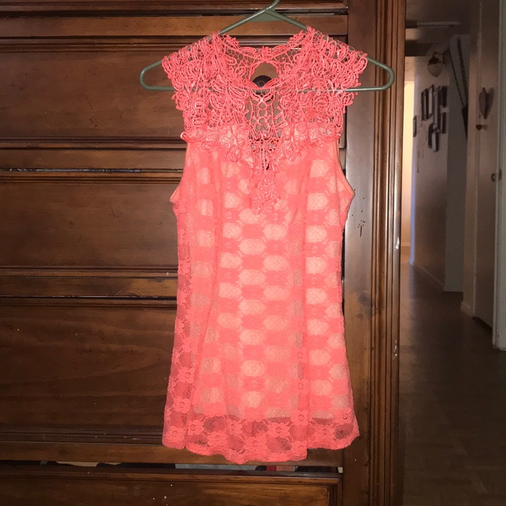 Im selling this bright pink shirt .